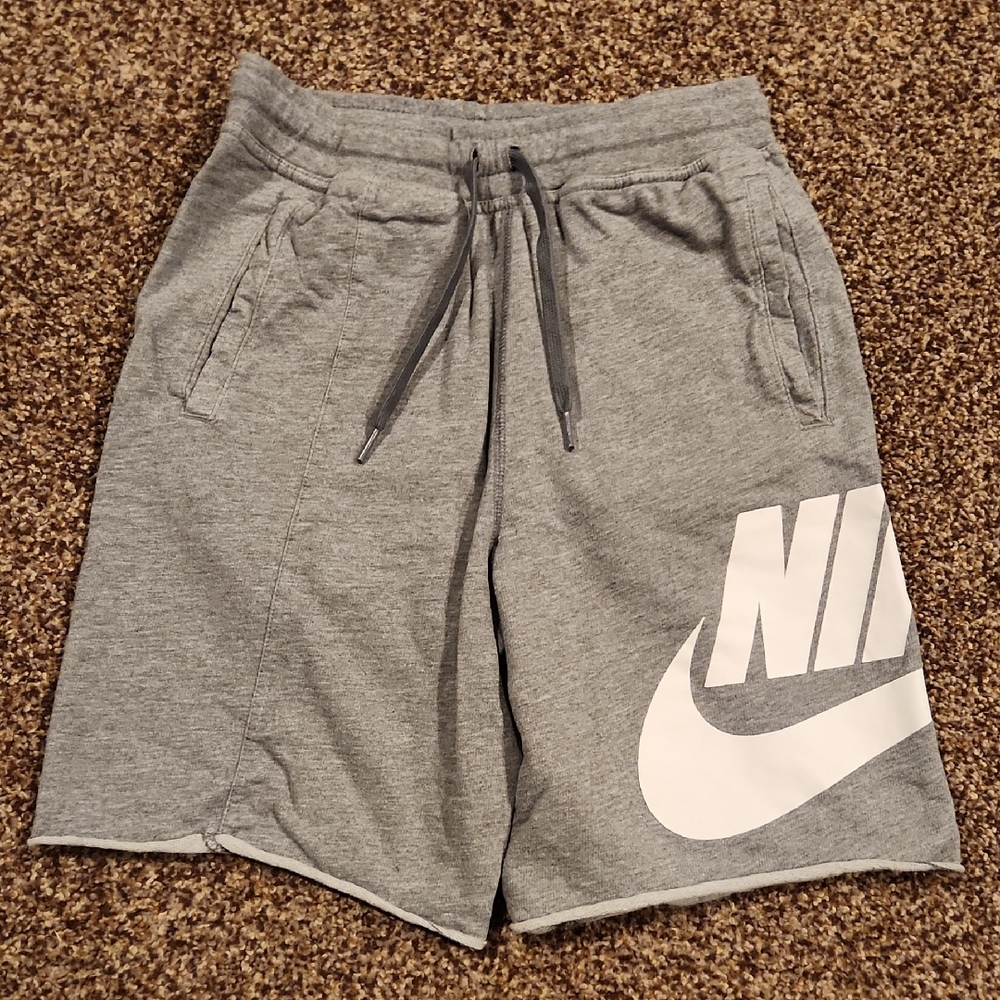 Nike Gray Athletic Shorts with White Swoosh and Drawstring